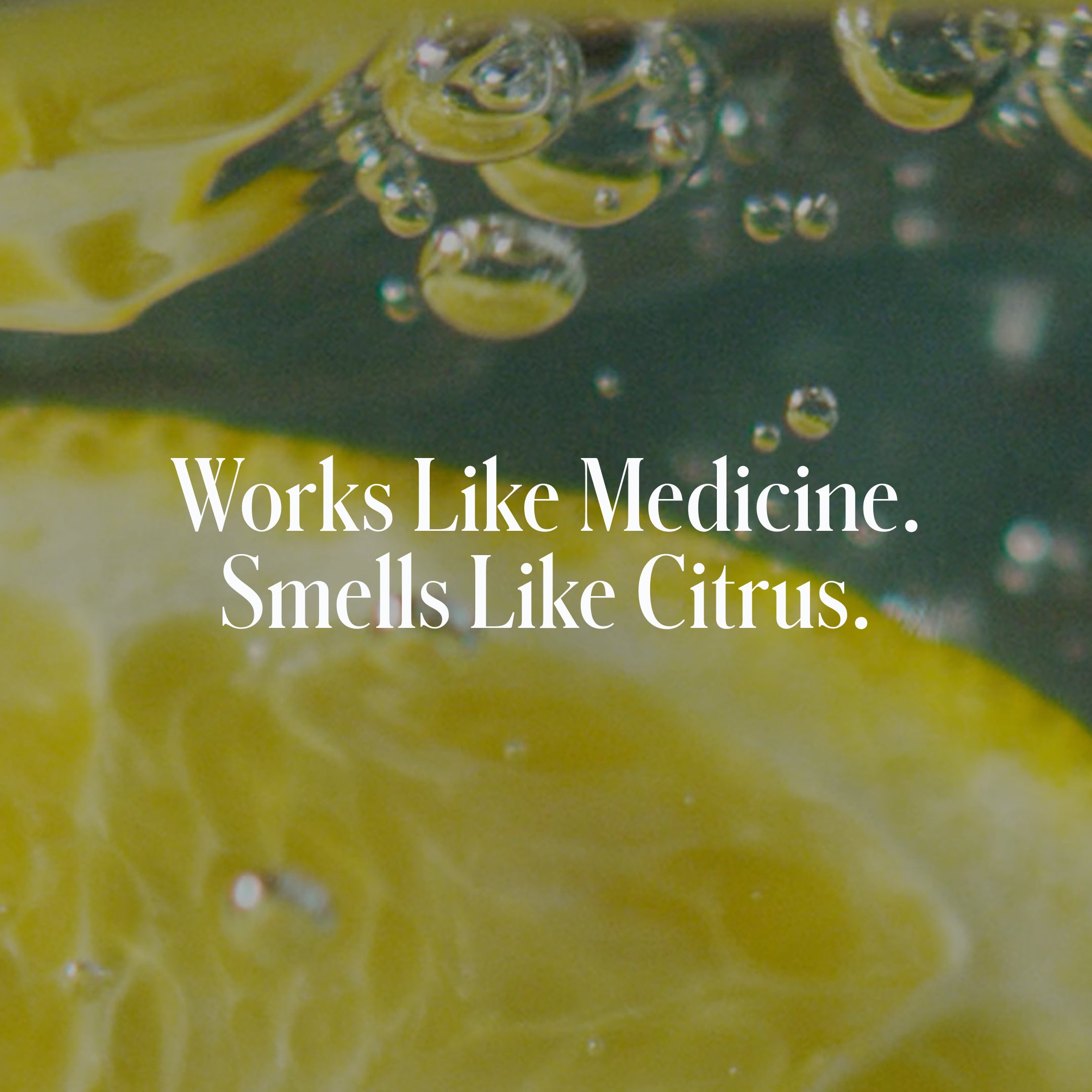 Close-up of lemon slices and bubbles in liquid with Works Like Medicine. Smells Like Citrus. in white font, showcasing the refreshing power of salicylic acid in Geologie's Acne Control Face Wash.