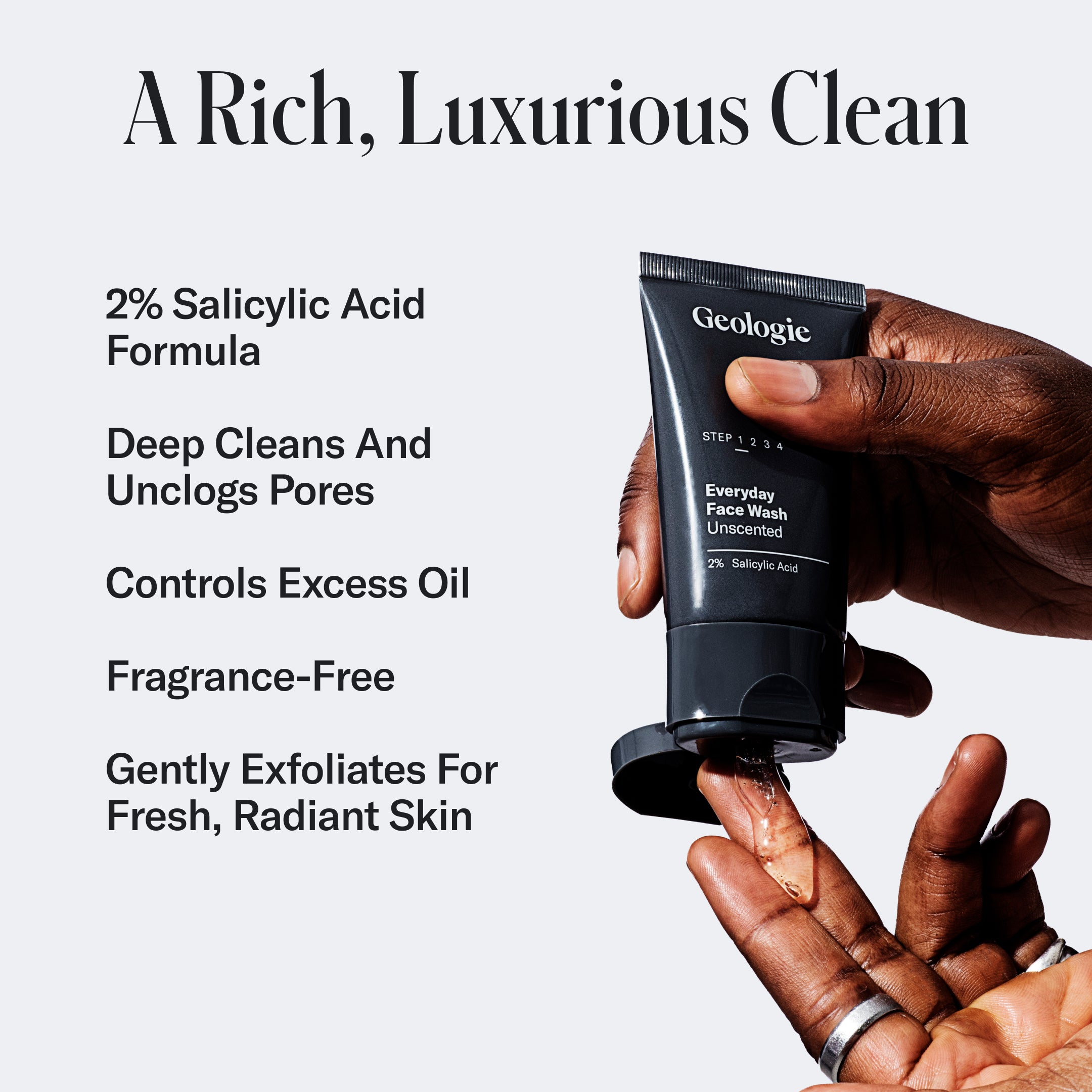 A hand is holding a tube of Geologie Adult Acne Routine. Text beside it highlights features: 2% Salicylic Acid, deep cleans and unclogs pores, controls excess oil, fragrance-free, gently exfoliates—your go-to acne treatment.